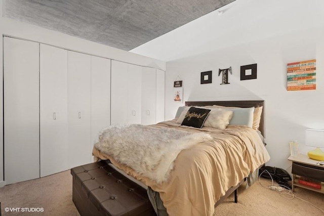 bedroom with carpet and a closet