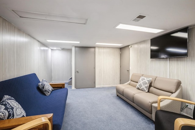 living area with stairway, carpet, and visible vents