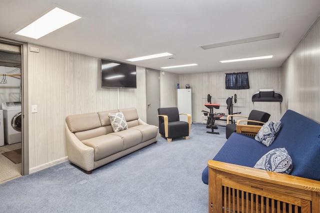 living area with carpet flooring and washer and clothes dryer