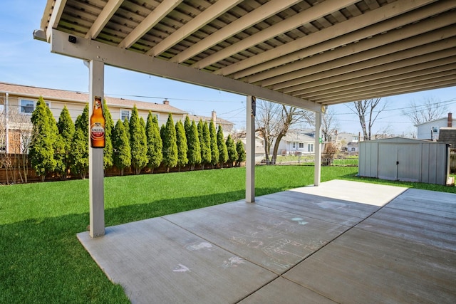 view of patio featuring a storage shed, fence, and an outdoor structure