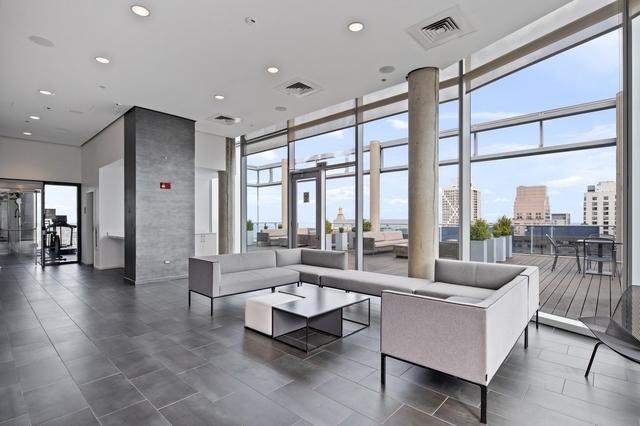 building lobby with visible vents and a city view