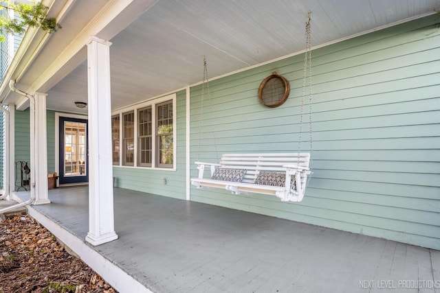 view of patio featuring a porch