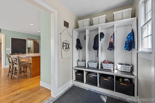mudroom with baseboards, wood finished floors, and recessed lighting