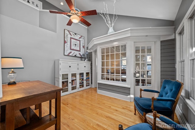 interior space with wood finished floors, high vaulted ceiling, and ceiling fan