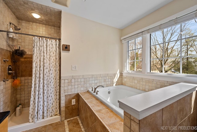 bathroom with a bath, tile patterned floors, visible vents, and a stall shower