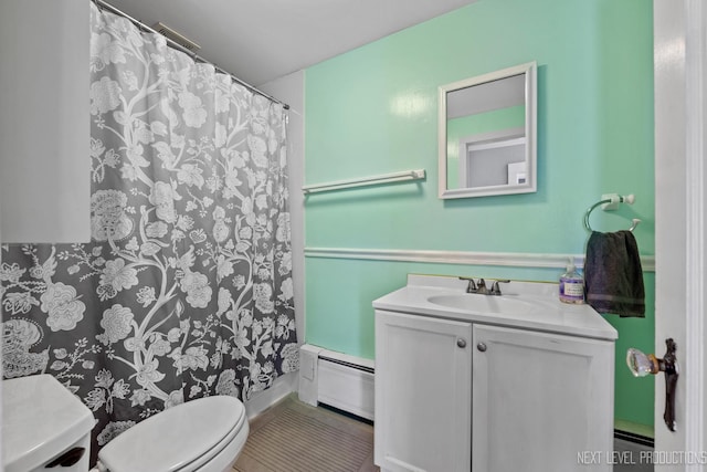 bathroom with a shower with curtain, vanity, a baseboard radiator, and toilet