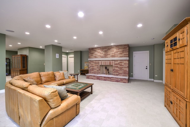 living room featuring recessed lighting, baseboards, a fireplace, and light colored carpet