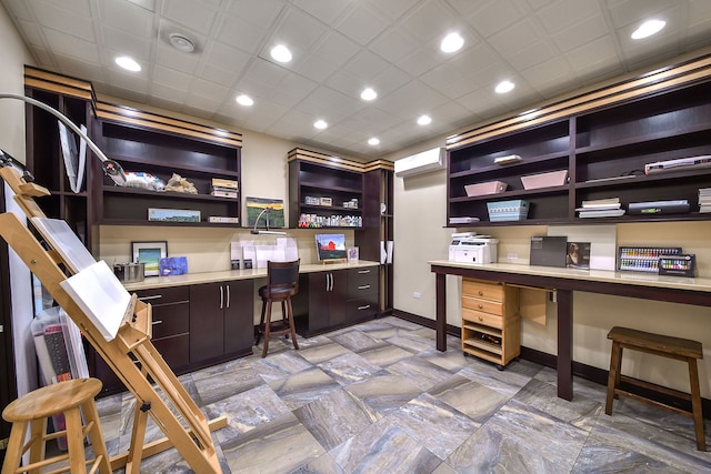 office with built in desk, baseboards, and recessed lighting