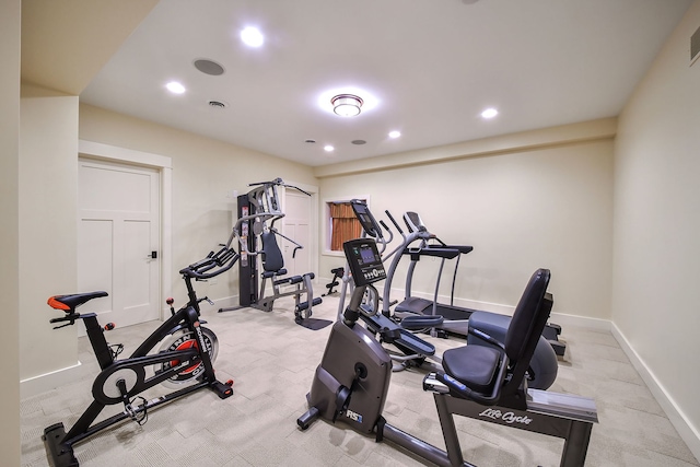 workout room featuring recessed lighting, baseboards, and light carpet