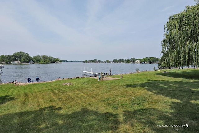 536 Circle Dr, Fox Lake, IL 60020 - view of grassy yard with a water view and a boat dock