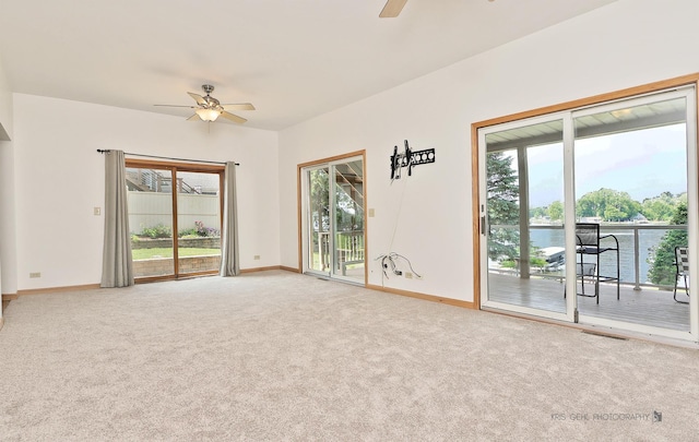 536 Circle Dr, Fox Lake, IL 60020 - carpeted spare room featuring a ceiling fan, healthy amount of natural light, and a water view
