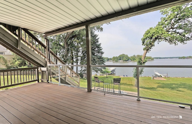 536 Circle Dr, Fox Lake, IL 60020 - deck with a water view, stairway, and a lawn