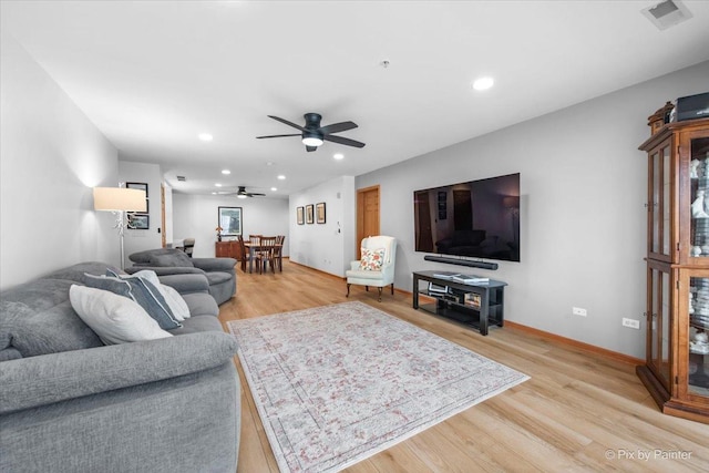 living room with ceiling fan, light wood-style flooring, recessed lighting, baseboards, and visible vents