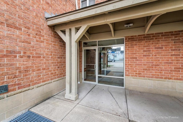 entrance to property with brick siding