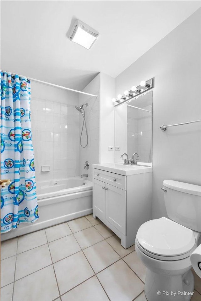 bathroom with shower / bath combo with shower curtain, visible vents, vanity, toilet, and tile patterned floors