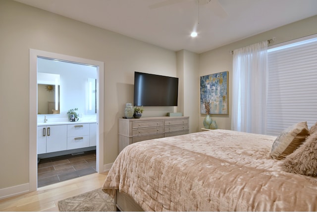 262 N Addison Ave, Elmhurst, IL 60126 - bedroom with wood finished floors, ensuite bath, and a ceiling fan