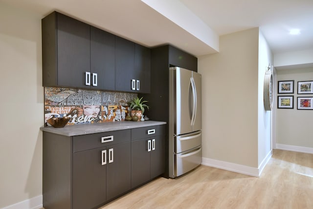262 N Addison Ave, Elmhurst, IL 60126 - kitchen featuring freestanding refrigerator, light wood-type flooring, decorative backsplash, light countertops, and dark cabinets