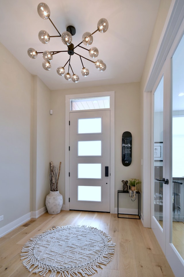 262 N Addison Ave, Elmhurst, IL 60126 - foyer with a chandelier and light wood-style flooring