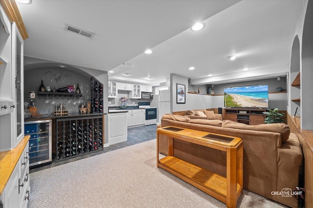 living room featuring a dry bar, wine cooler, and recessed lighting
