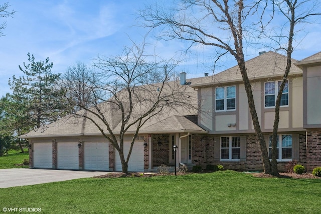 1198 Streamwood Ln Unit 1198, Vernon Hills, IL 60061 - view of front of house with a garage, brick siding, driveway, and a front lawn