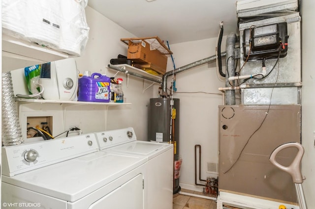 1198 Streamwood Ln Unit 1198, Vernon Hills, IL 60061 - laundry room featuring water heater, washing machine and dryer, heating unit, light tile patterned flooring, and laundry area