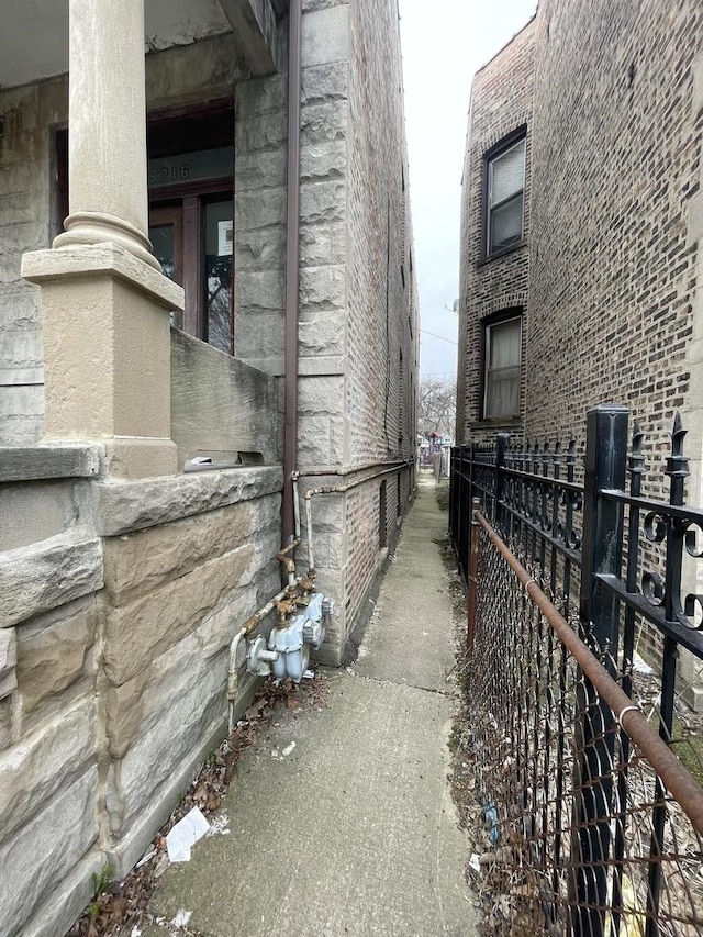 view of side of property with fence