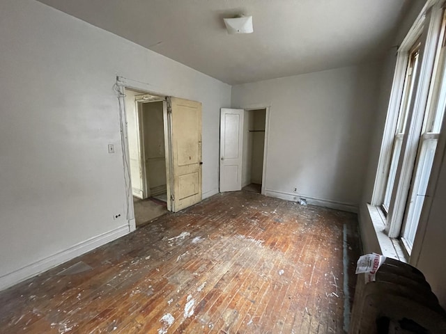 unfurnished bedroom featuring wood-type flooring
