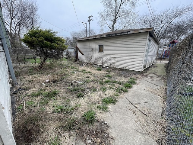 view of outdoor structure with fence