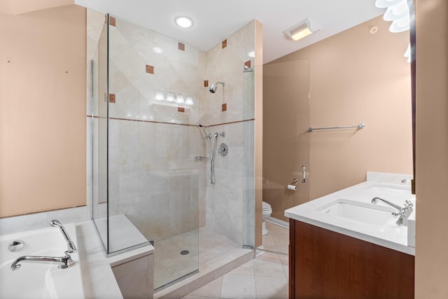 bathroom with a shower stall, a bath, toilet, a sink, and double vanity