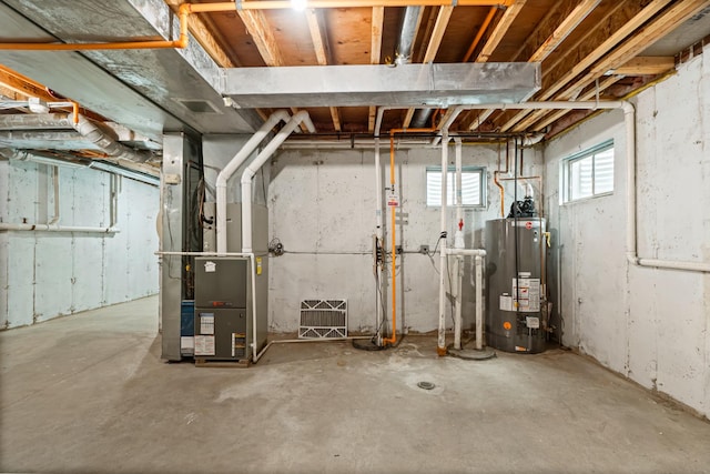 basement with heating unit and gas water heater