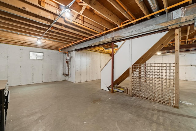 unfinished basement with stairway