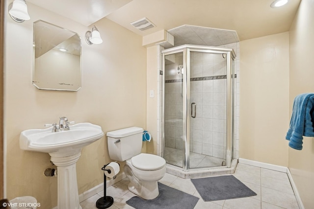 full bathroom featuring a shower stall, tile patterned floors, visible vents, and toilet