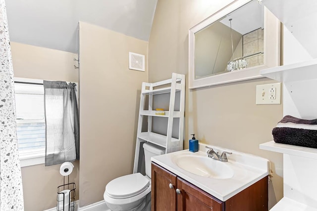 bathroom featuring toilet and vanity