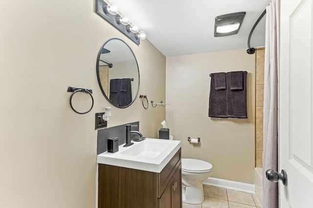 bathroom with vanity, toilet, shower / tub combo, tile patterned floors, and baseboards