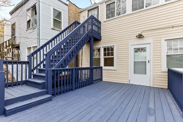 wooden deck featuring stairs