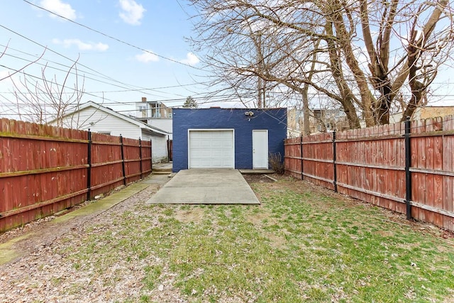 view of yard featuring a fenced backyard and an outdoor structure