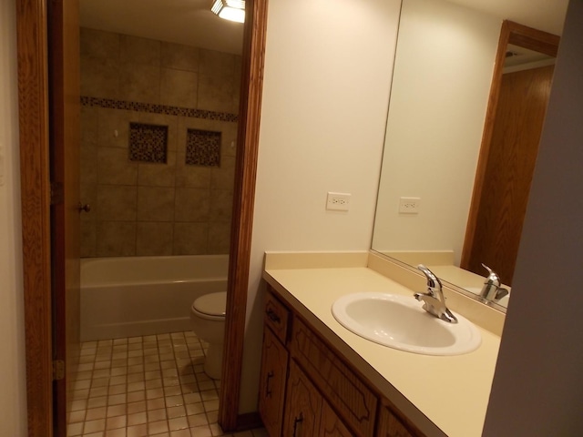 bathroom featuring  shower combination, tile patterned flooring, vanity, and toilet