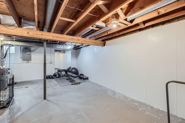 unfinished basement featuring electric panel