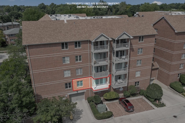 17 E Hattendorf Ave Unit 205, Roselle, IL 60172 - view of building exterior featuring driveway and a garage