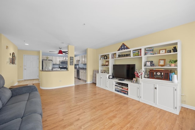 17 E Hattendorf Ave Unit 205, Roselle, IL 60172 - living room with light wood-style flooring and ceiling fan