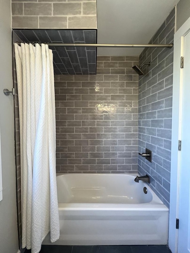 bathroom with shower / bath combo with shower curtain
