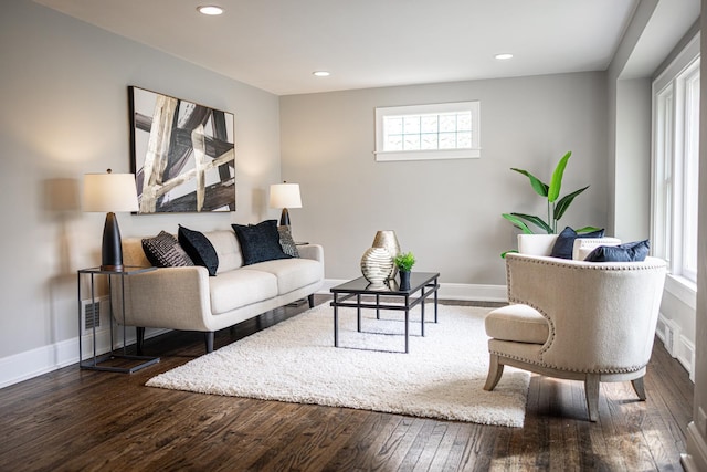 living area with recessed lighting, baseboards, and hardwood / wood-style flooring