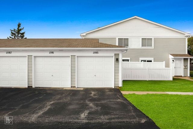 1593 Cornell Pl, Hoffman Estates, IL 60169 - view of front facade featuring community garages and roof with shingles