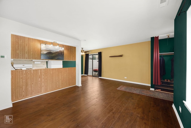 1593 Cornell Pl, Hoffman Estates, IL 60169 - unfurnished living room featuring ceiling fan, dark wood-style flooring, and baseboards