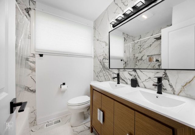 bathroom featuring visible vents, marble finish floor, a sink, and toilet