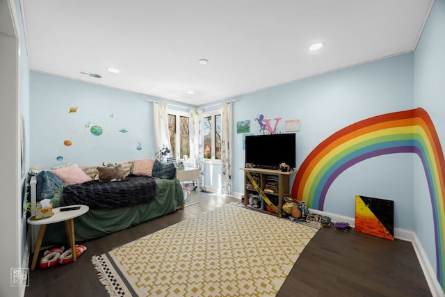 bedroom featuring wood finished floors, baseboards, and recessed lighting