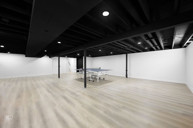 finished basement with wood finished floors and baseboards