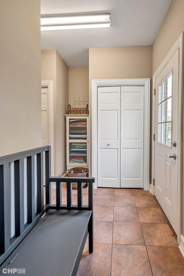 recreation room with tile patterned floors