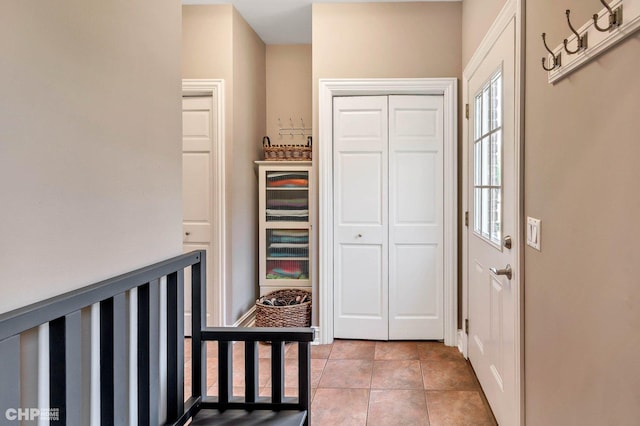 entryway with light tile patterned floors