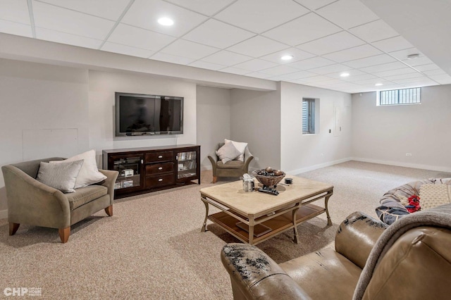living room featuring a paneled ceiling, light colored carpet, baseboards, and recessed lighting